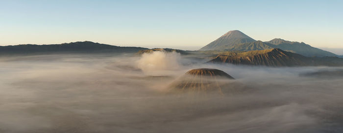 Scenic view of volcanic mountain against sky