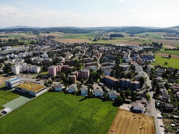 High angle view of buildings in city against sky