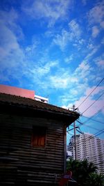 Low angle view of building against blue sky