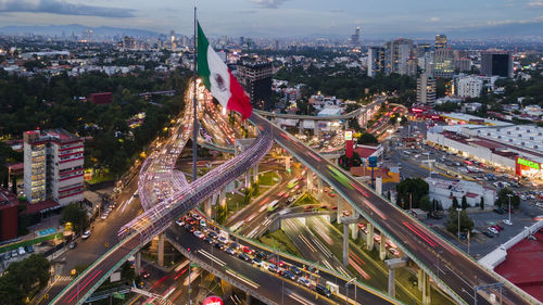 High angle view of illuminated buildings in city at night