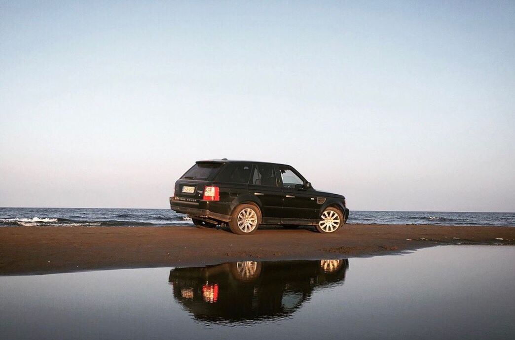 VIEW OF CAR ON BEACH