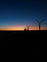 Silhouette landscape against sky during sunset