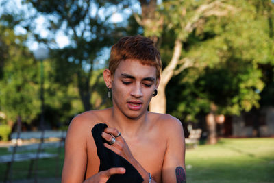 Young handsome boy outdoors in a park