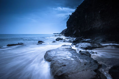 Scenic view of sea against blue sky