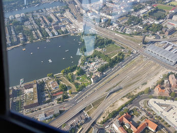 High angle view of road by buildings in city