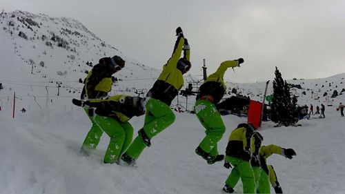 Panoramic view of people on snow covered mountain