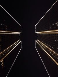 Illuminated tunnel at night