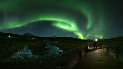 Scenic view of mountains against sky at night