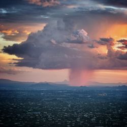 Scenic view of cloudy sky at sunset