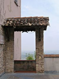 Entrance of building terrace against clear sky