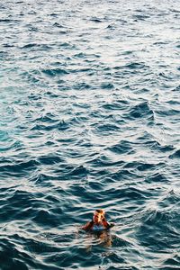 Boy swimming in sea