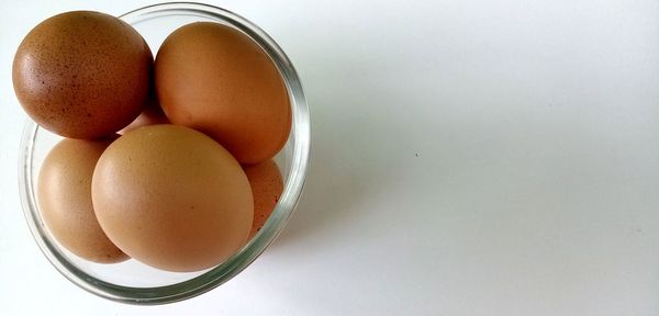 High angle view of eggs in bowl on table