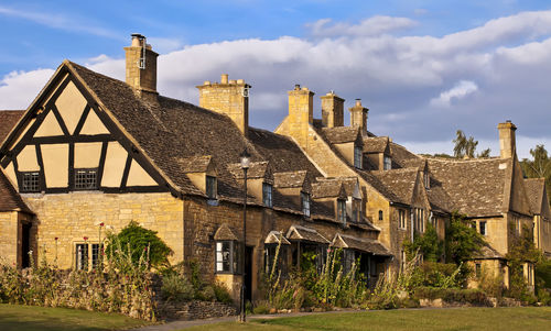 Exterior of house on field against sky