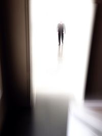 Close-up of woman standing on tiled floor