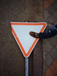 Low section of person standing on heart shape sign