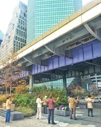 Woman standing on city street