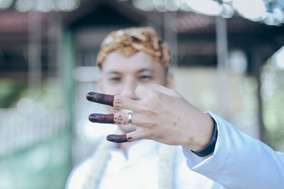 Portrait of man holding camera