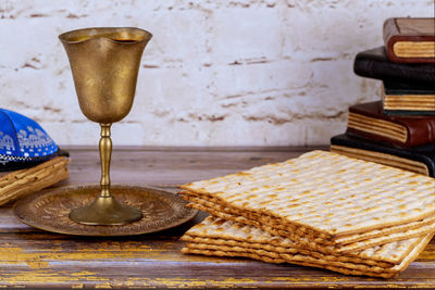 Pesah holiday celebration, matza unleavened bread and cup kosher wine