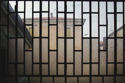 Full frame shot of building seen through window