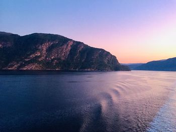 Scenic view of sea against clear sky during sunset