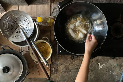 High angle view of man preparing food in kitchen at home