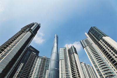Low angle view of buildings in city against sky