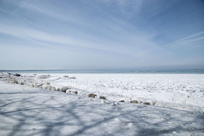 Scenic view of sea against sky during winter