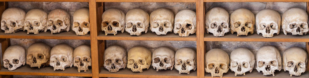 Close-up of clothes hanging in row