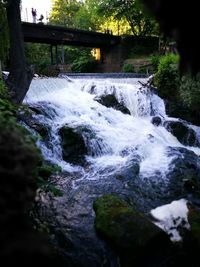 Scenic view of river flowing through rocks