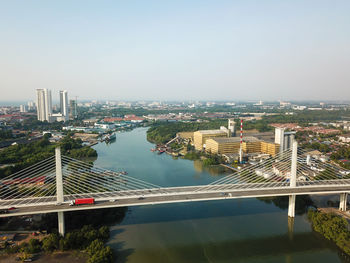 High angle view of bridge over river against buildings in city