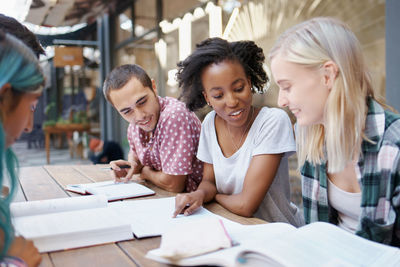 Portrait of smiling business colleagues working at office