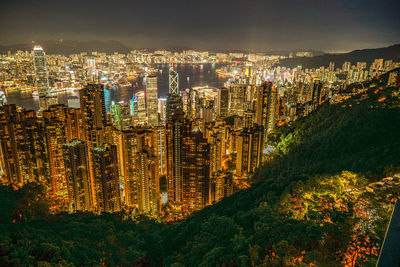 High angle view of illuminated buildings in city at night