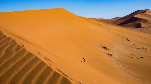 Scenic view of desert against clear sky