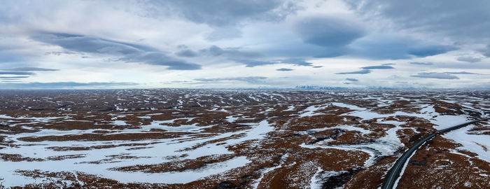 Aerial video of an empty lava fields and huge volcanic mountain in iceland