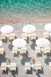 High angle view of beach umbrellas by sea