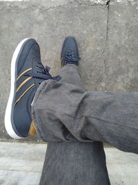 Low section of man standing on floor