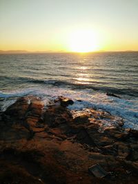 Scenic view of sea at sunset