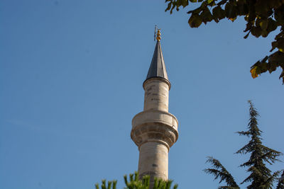 Low angle view of building against clear blue sky