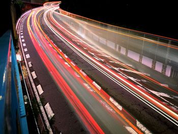 High angle view of light trails on road at night