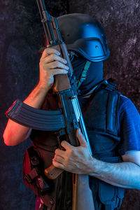 Counterterrorist with obscured face holding ak-47