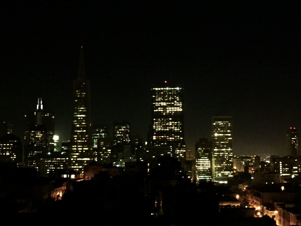 night, building exterior, architecture, city, illuminated, built structure, skyscraper, cityscape, tower, tall - high, clear sky, modern, office building, urban skyline, copy space, crowded, city life, tall, financial district, capital cities