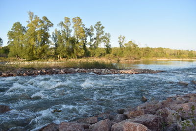 Scenic view of river against sky