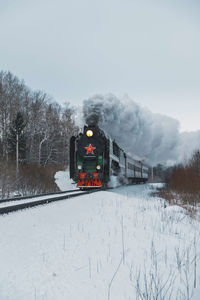 Train on snow covered landscape