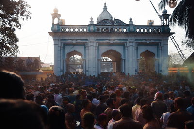 Group of people in front of historical building