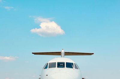 Low angle view of airplane against sky