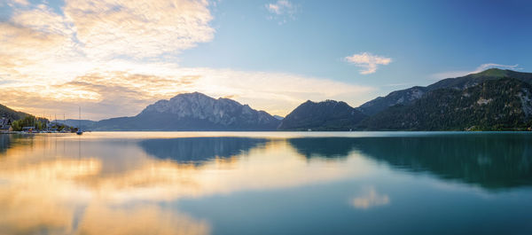 Scenic view of lake and mountains against sky