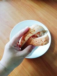 High angle view of person preparing food on table