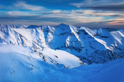 Scenic view of snowcapped mountains against sky