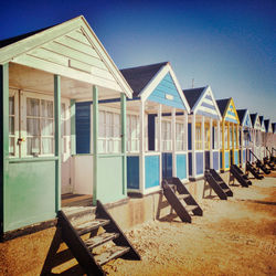 Beach huts along the seafront at southwold, suffolk.