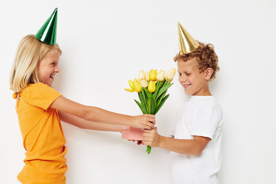 Portrait of smiling woman holding bouquet